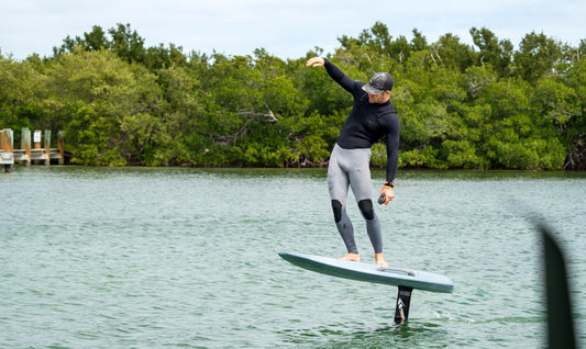 A man is having an efoil session in calm waters in Miami.
