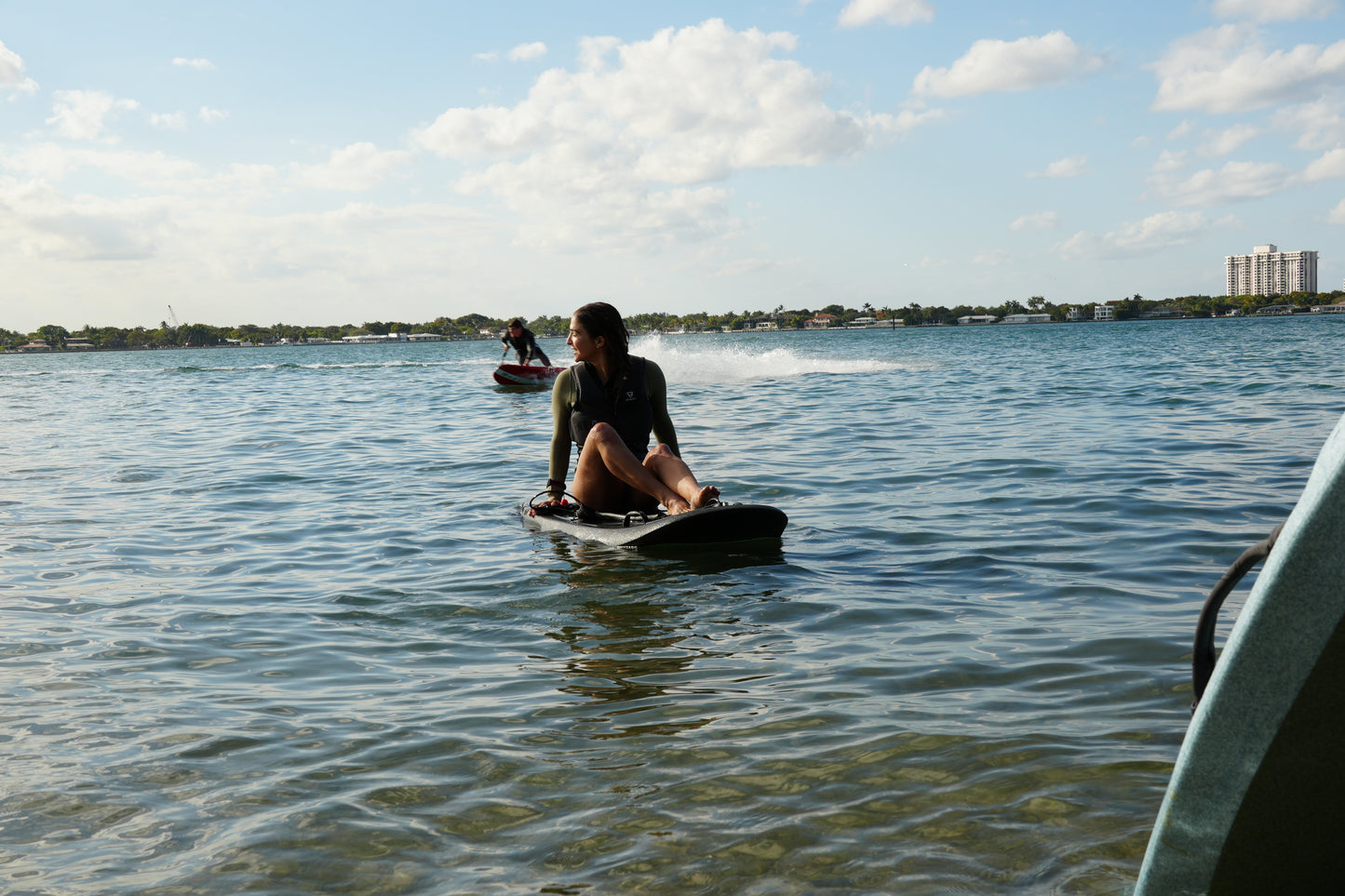Rider testing a Moovi electric surfboard before buying