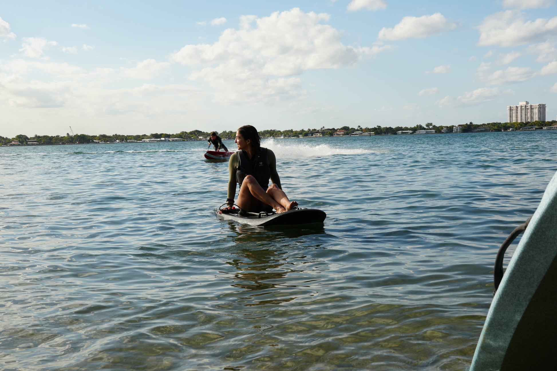 Rider testing a Moovi electric surfboard before buying