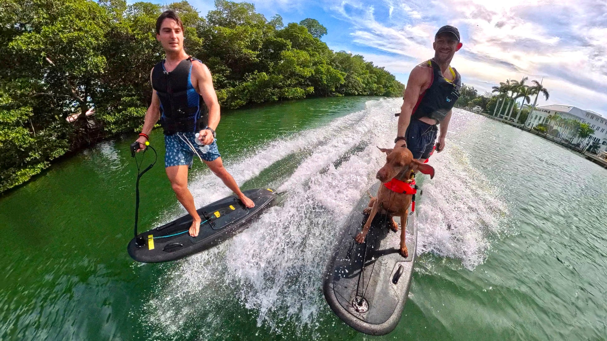 Friends riding Moovi electric surfboards together on Biscayne Bay