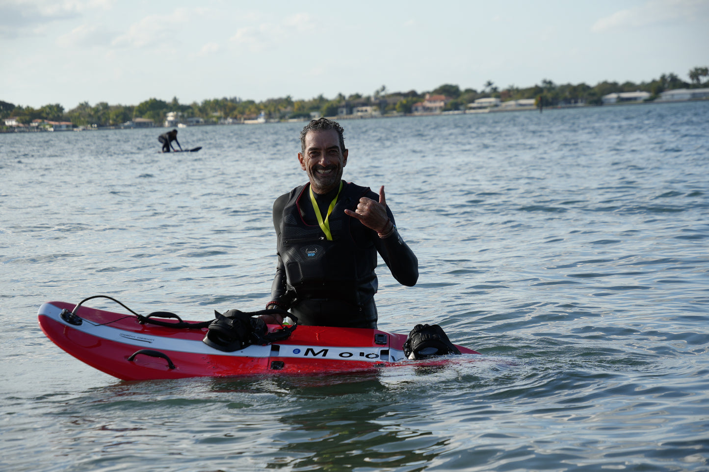 Instructor riding a Moovi electric surfboard on Biscayne Bay
